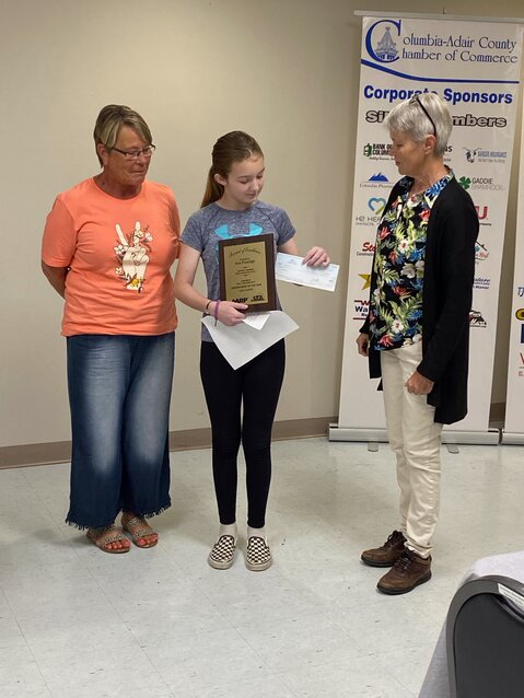 Grandmother Gina Harmon, Ava Froedge, and ACRTA President Mary Ann McQuaide.