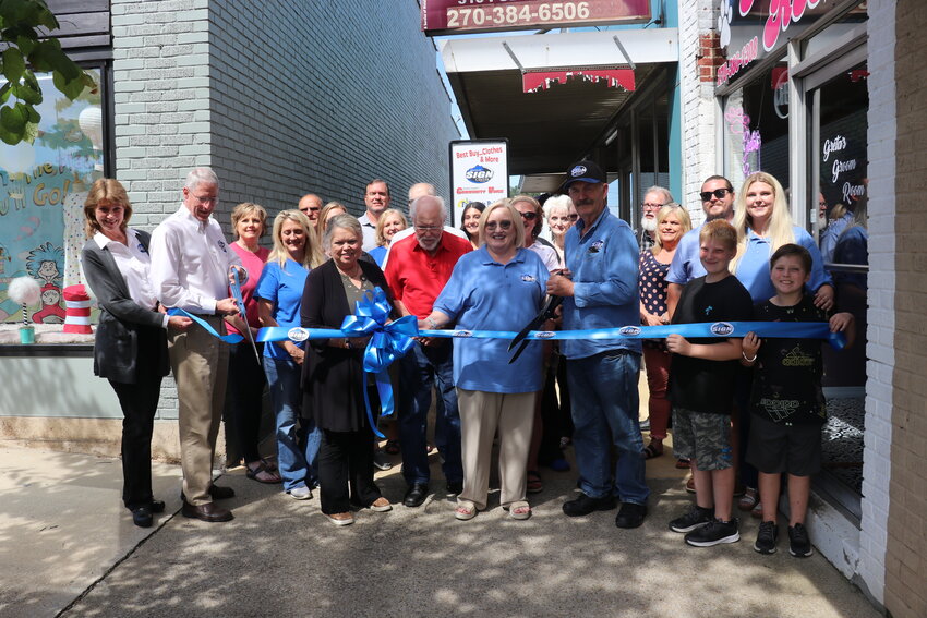 Kentucky Sign Center - Columbia held a ribbon cutting last week along with an open house. The new business, which is operated by Donnie and Sharon Burton (center) in partnership with Kentucky Sign Center, London owners Claudia and Jay Nolan (far left) can provide banners, yard signs, business lighted signs, perforated windows, and more. It is located at 316 Public Sq. inside the Community Voice office and can be reached at 270-849-5509.